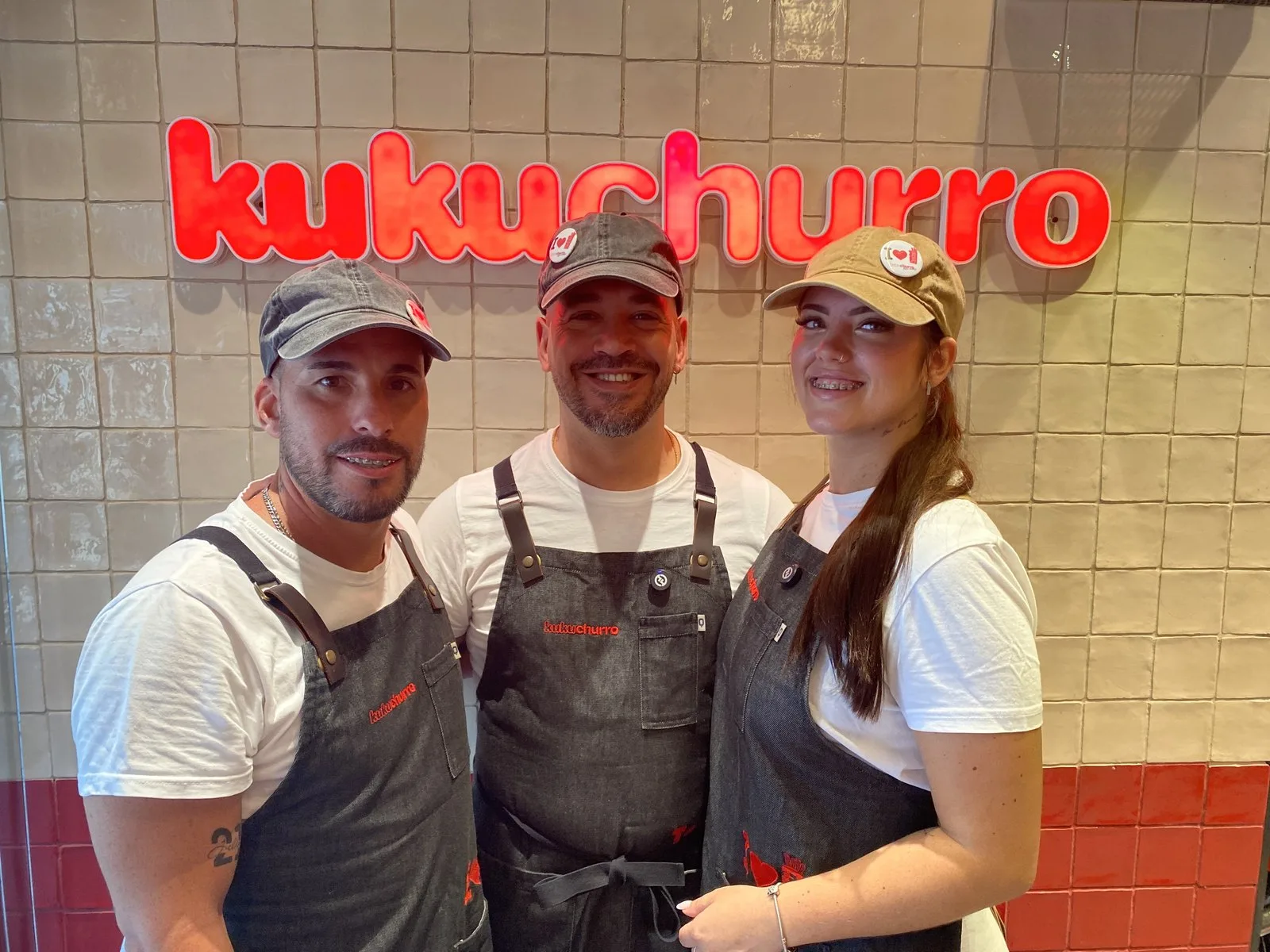 The Kukuchurro Catedral team in front of the shop logo