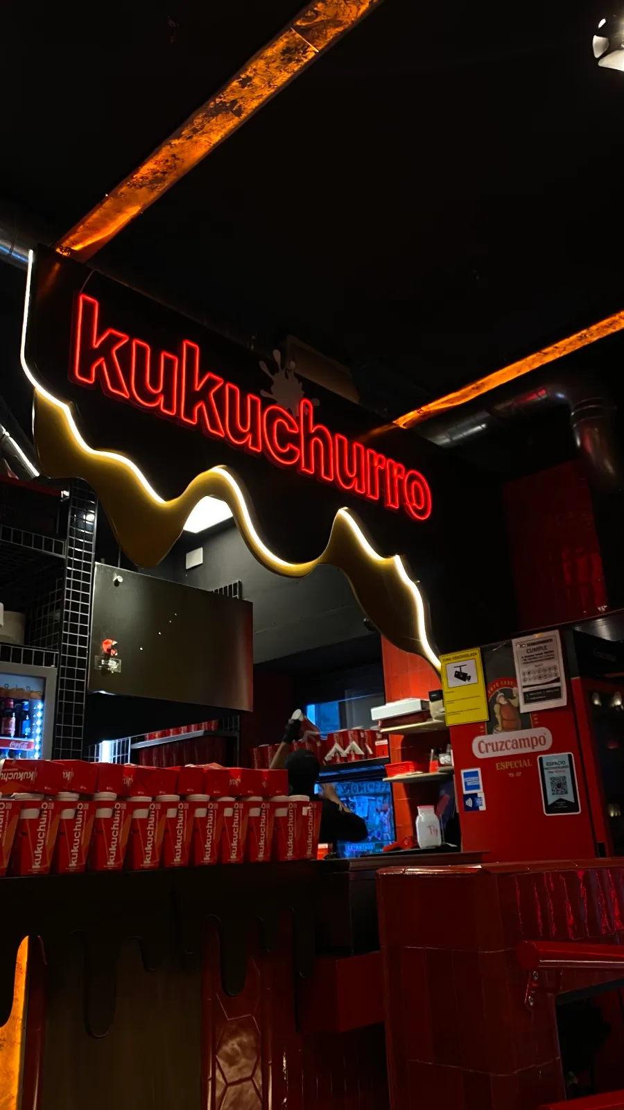 Kukuchurro neon sign inside the Regina shop