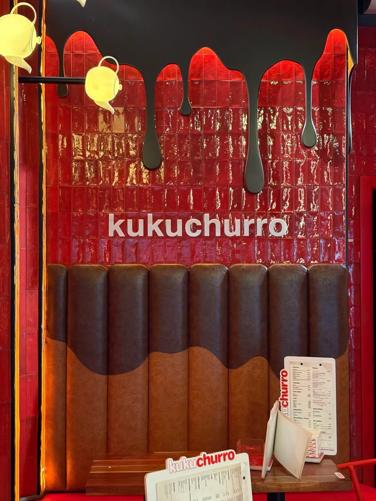 Red tiled wall with dripping chocolate at Kukuchurro Regina